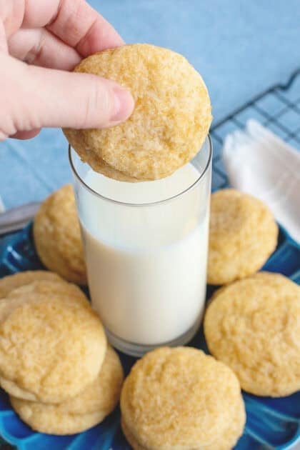 Dipping a butter cookie into a glass of milk