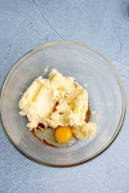 Large egg and vanilla in a bowl with the other ingredients