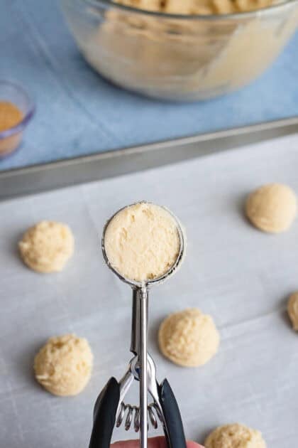 Shaping the butter cookie mixture with a scoop