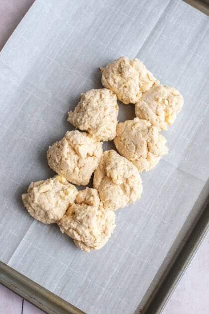 Raw cathead biscuits on a pan