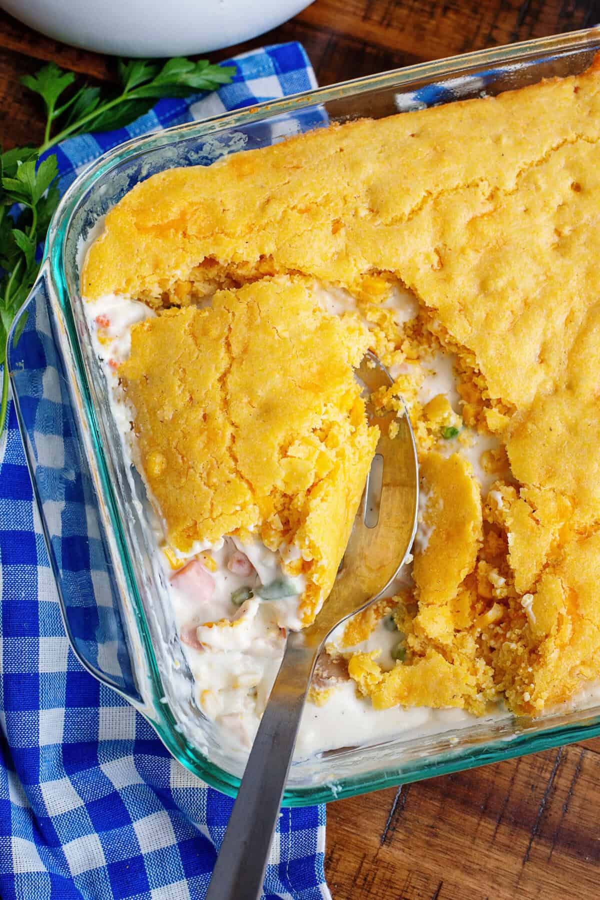 Taking a scoop out of cornbread chicken pot pie.