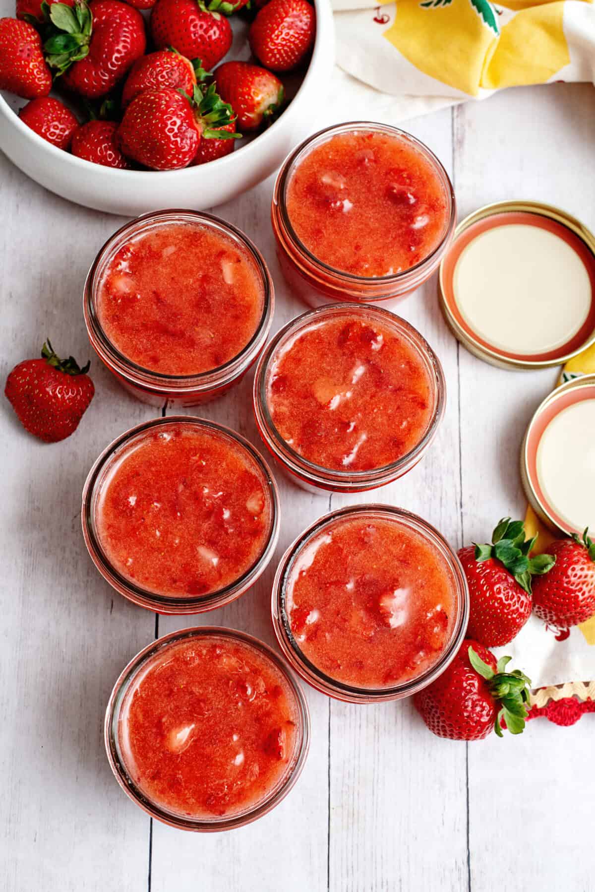 Mason jars of easy strawberry freezer jam