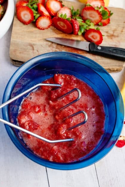 Crushed strawberries in a bowl