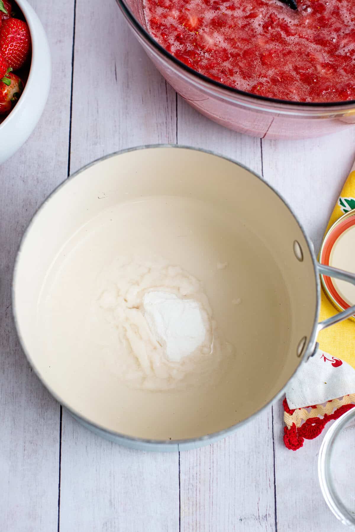 Mixing water and fruit pectin in a bowl