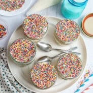 Top-down view of a tray of Funfetti dot cake jars