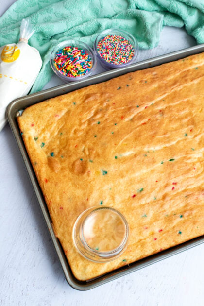 Using a mason jar to cut out the Funfetti dot cake jar base