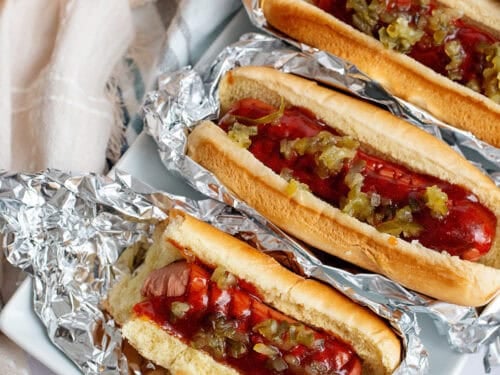 Copycat J Dawgs Hot Dogs lined up on tin foil