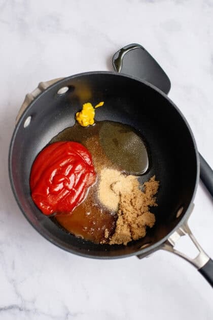 ketchup, brown sugar, honey, apple cider vinegar, yellow mustard, Worcestershire sauce, onion powder, and garlic powder in a small pan
