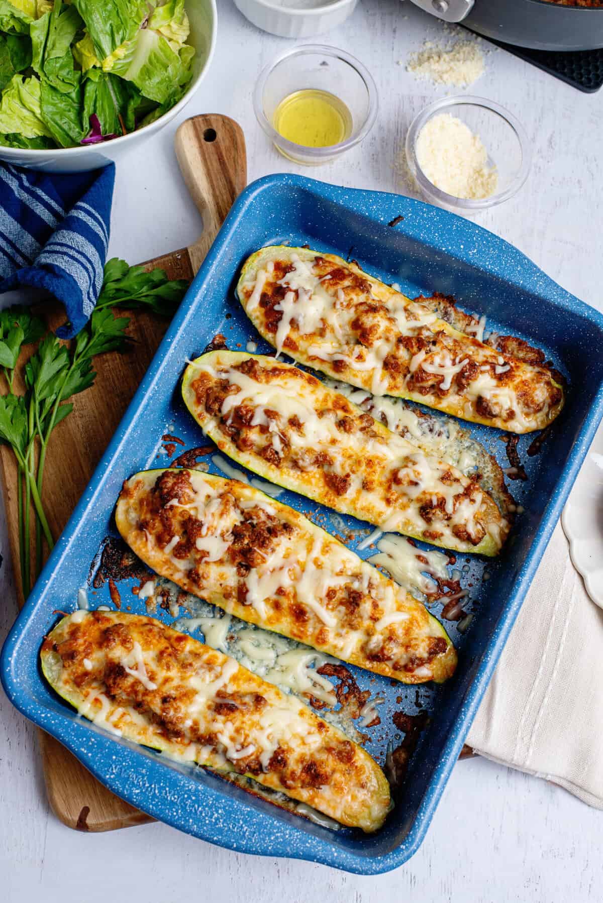 A baked tray of zucchini stuffed boats