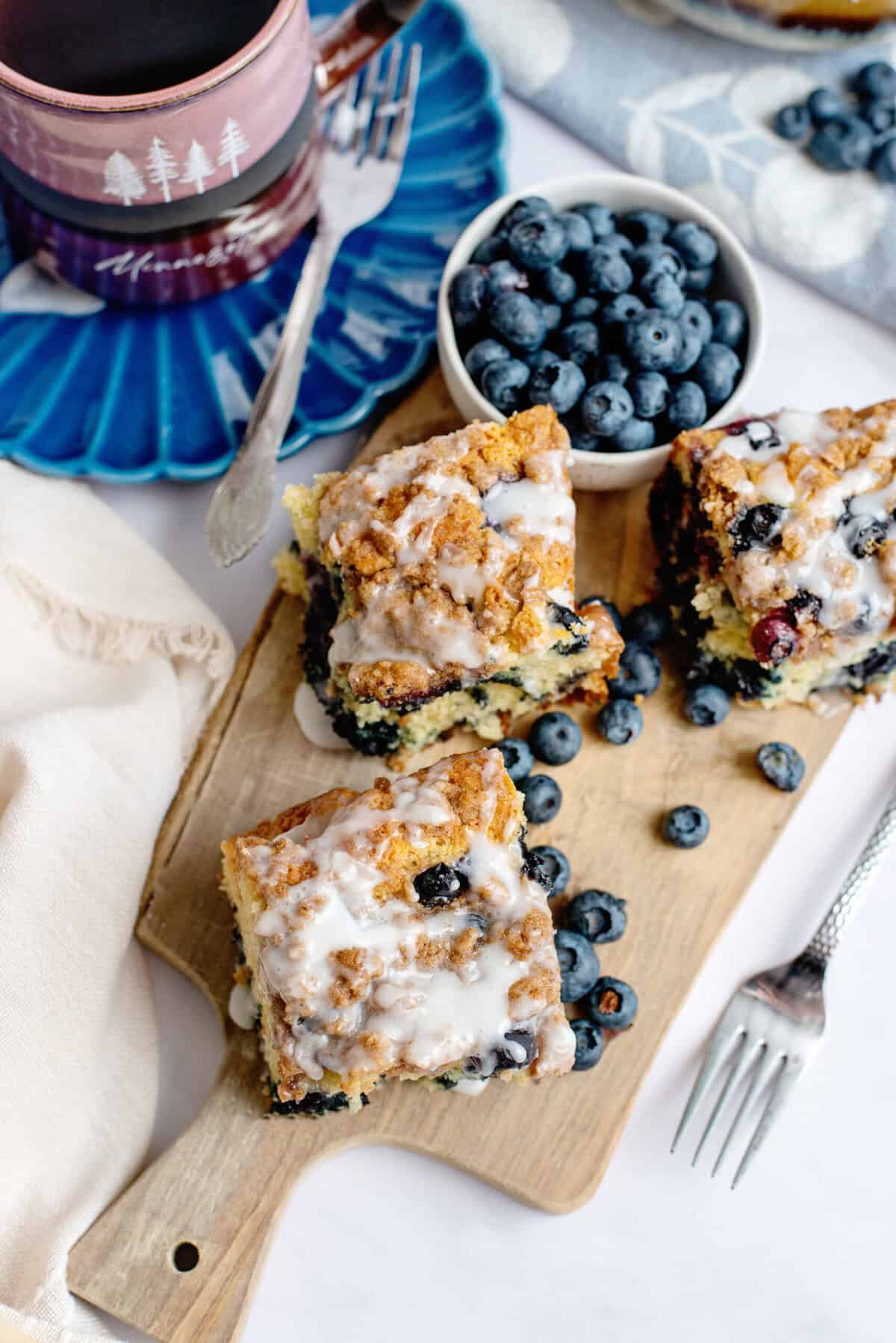 Blueberry coffee cake squares on a cutting board