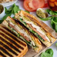 Chicken pesto paninis on a cutting board