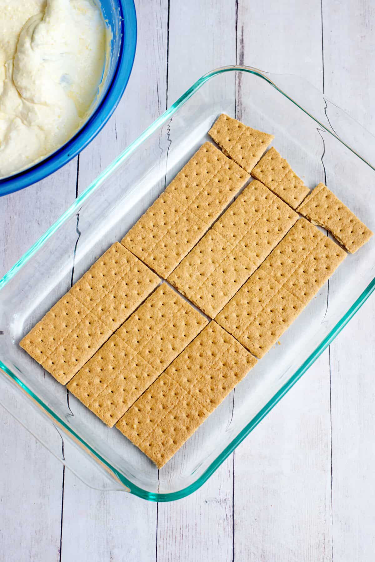 A layer of graham crackers in a baking pan