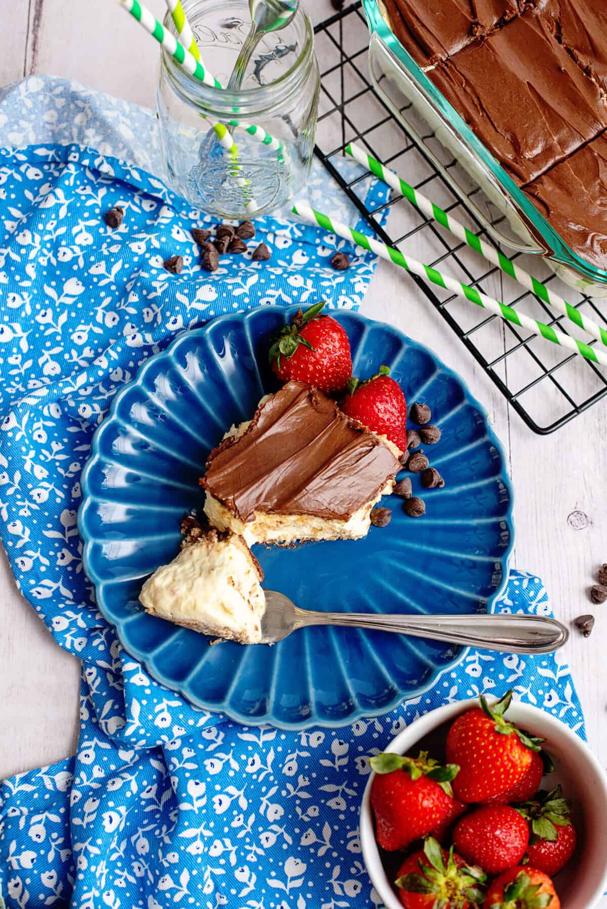 Top view of a slice of chocolate eclaire cake on a plate