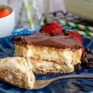Chocolate eclair icebox cake on a blue plate with a fork.