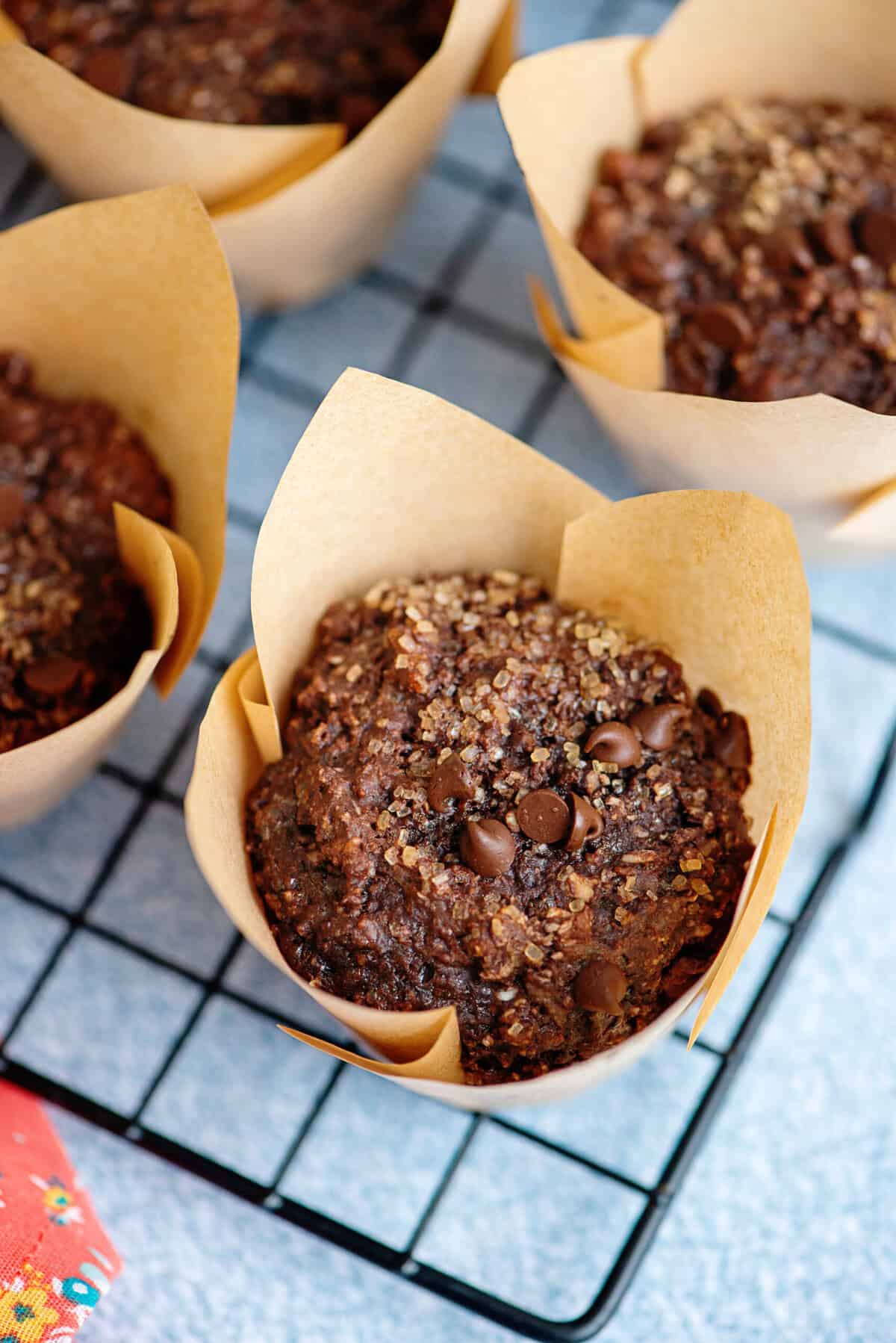 Baked chocolate cottage cheese muffins on a wire cooling rack