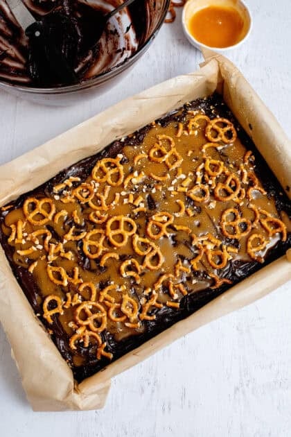 Pretzels on the caramel-topped brownie batter layer