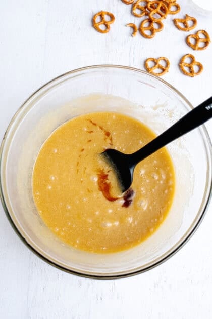 vanilla extract being added to a mixing bowl