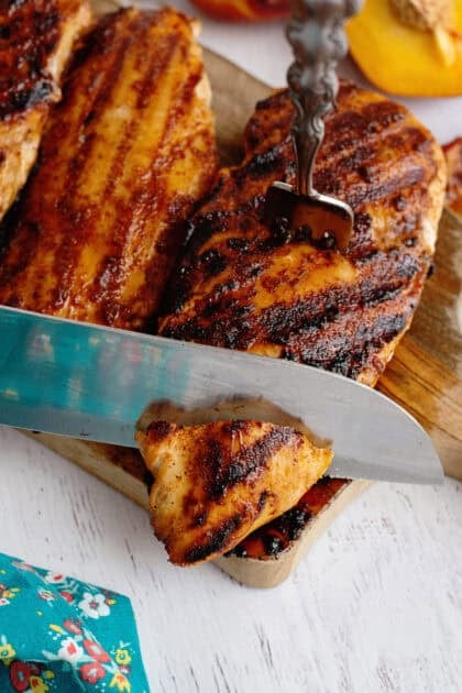 Slicing the sweet tea brine chicken with a knife