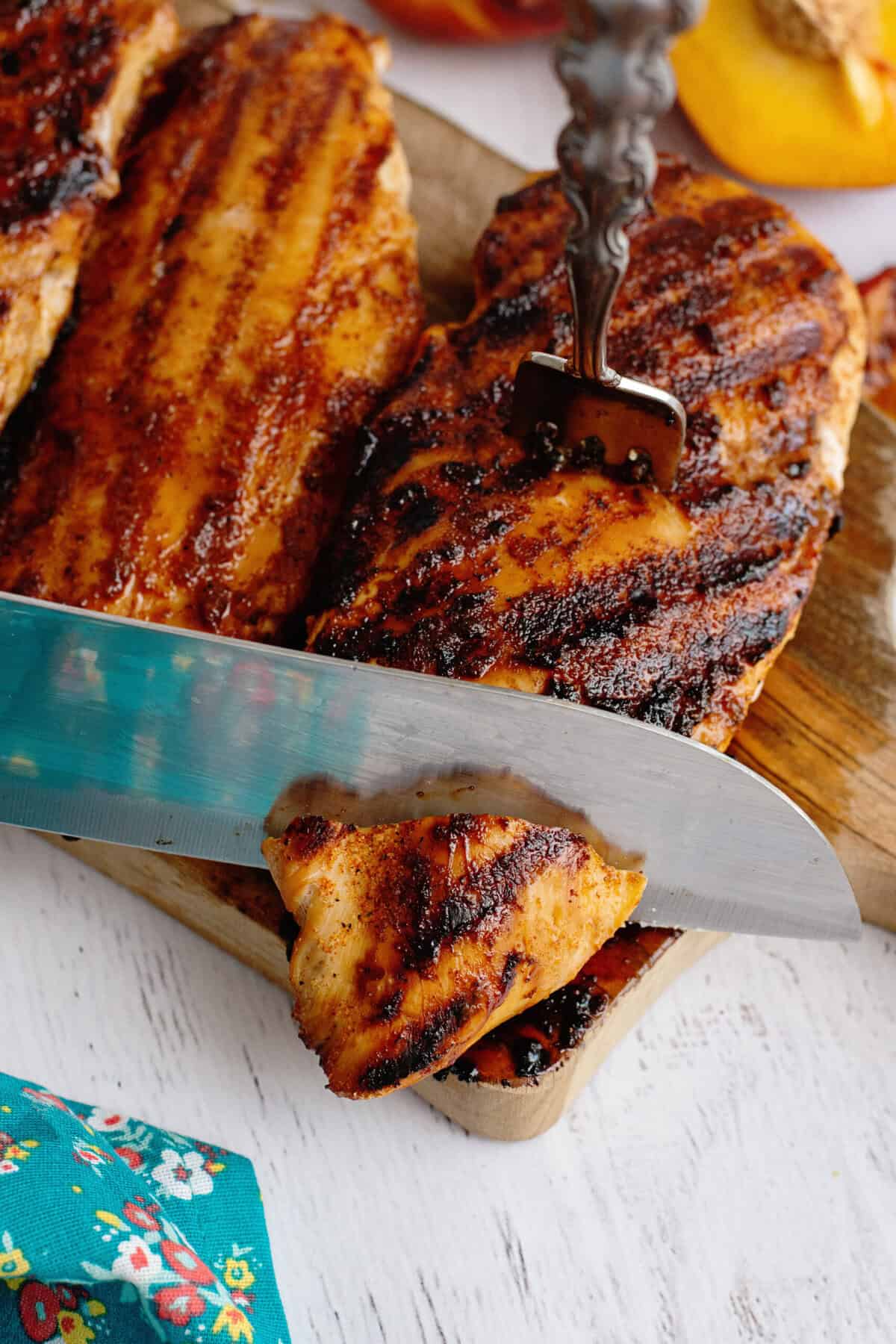 Slicing the sweet tea brine chicken with a knife