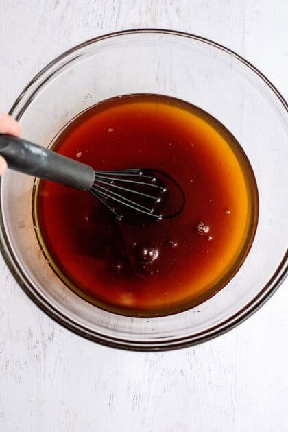 Stirring the sweet tea to dissolve the salt and sugar