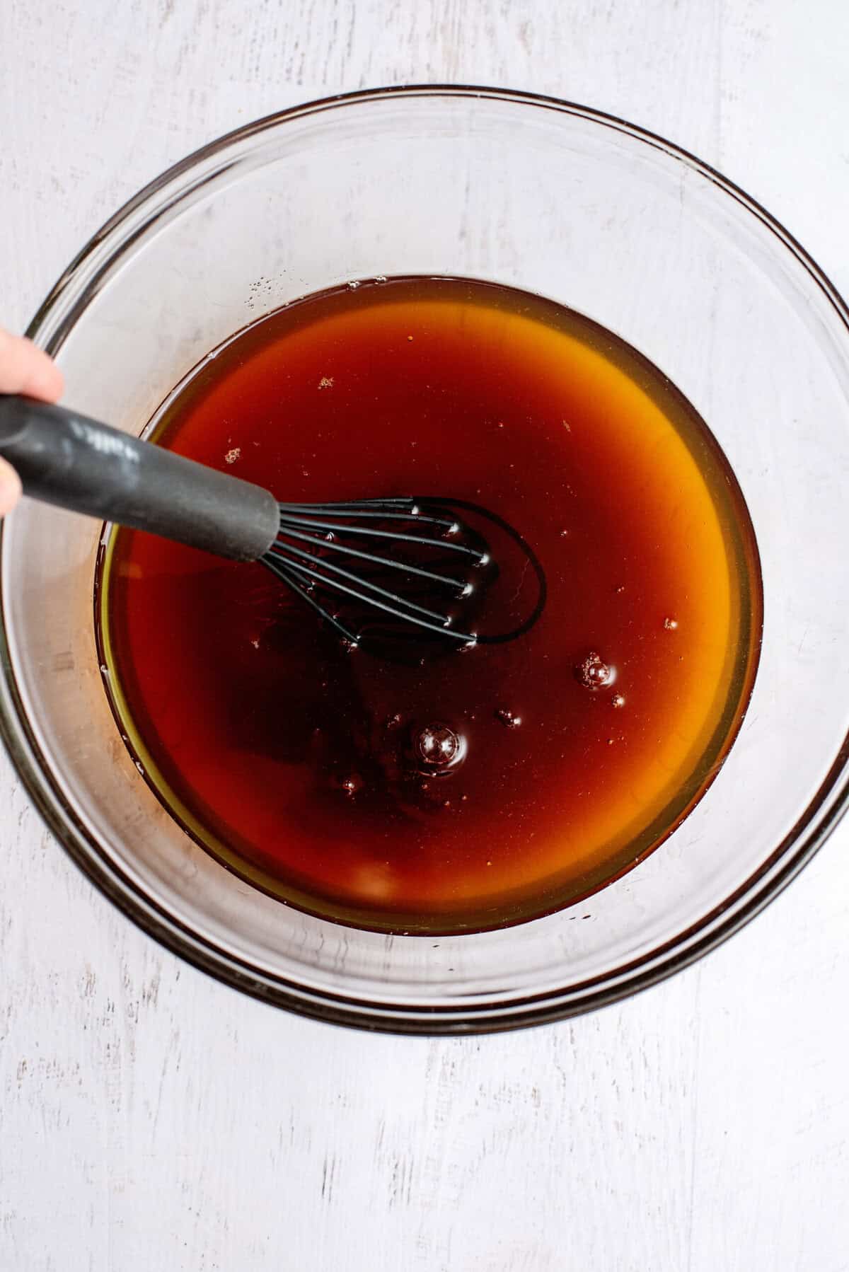 Stirring the sweet tea to dissolve the salt and sugar
