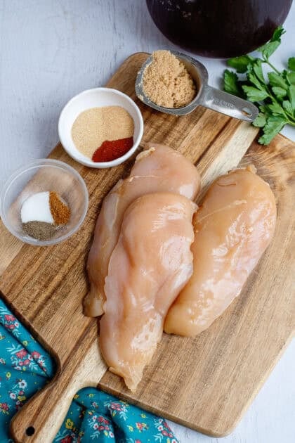 Soaked raw chicken on a cutting board