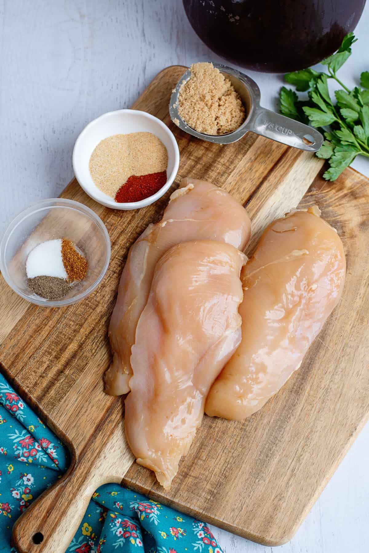 Soaked raw chicken on a cutting board