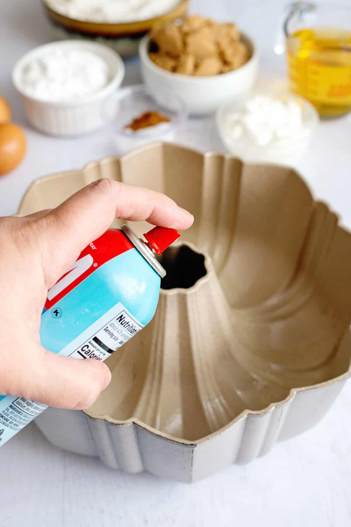 Greasing a bundt cake pan.