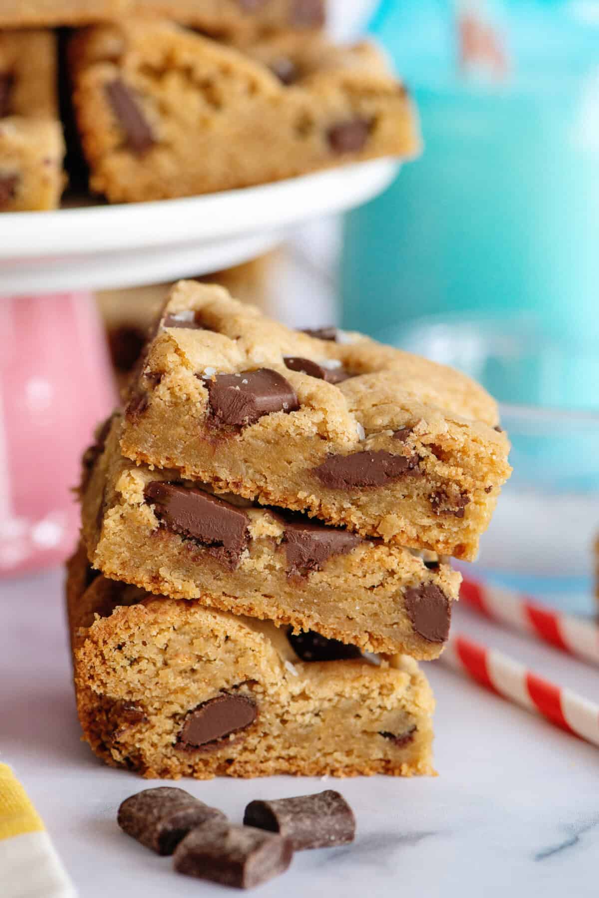 A stack of three chocolate chip cookie bars.
