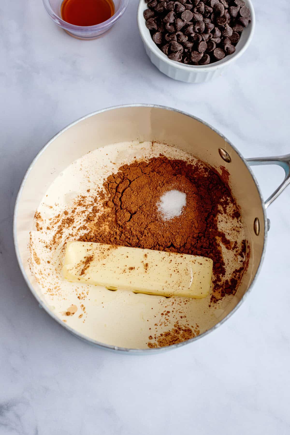 Heavy cream, butter, corn syrup, cocoa powder, and salt in a saucepan.