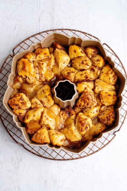 Apple pie cinnamon roll monkey bread in a bundt pan fresh out the oven.