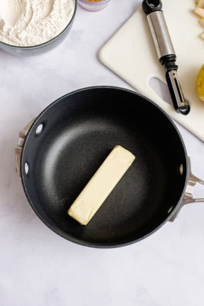 Stick of butter on a pan.
