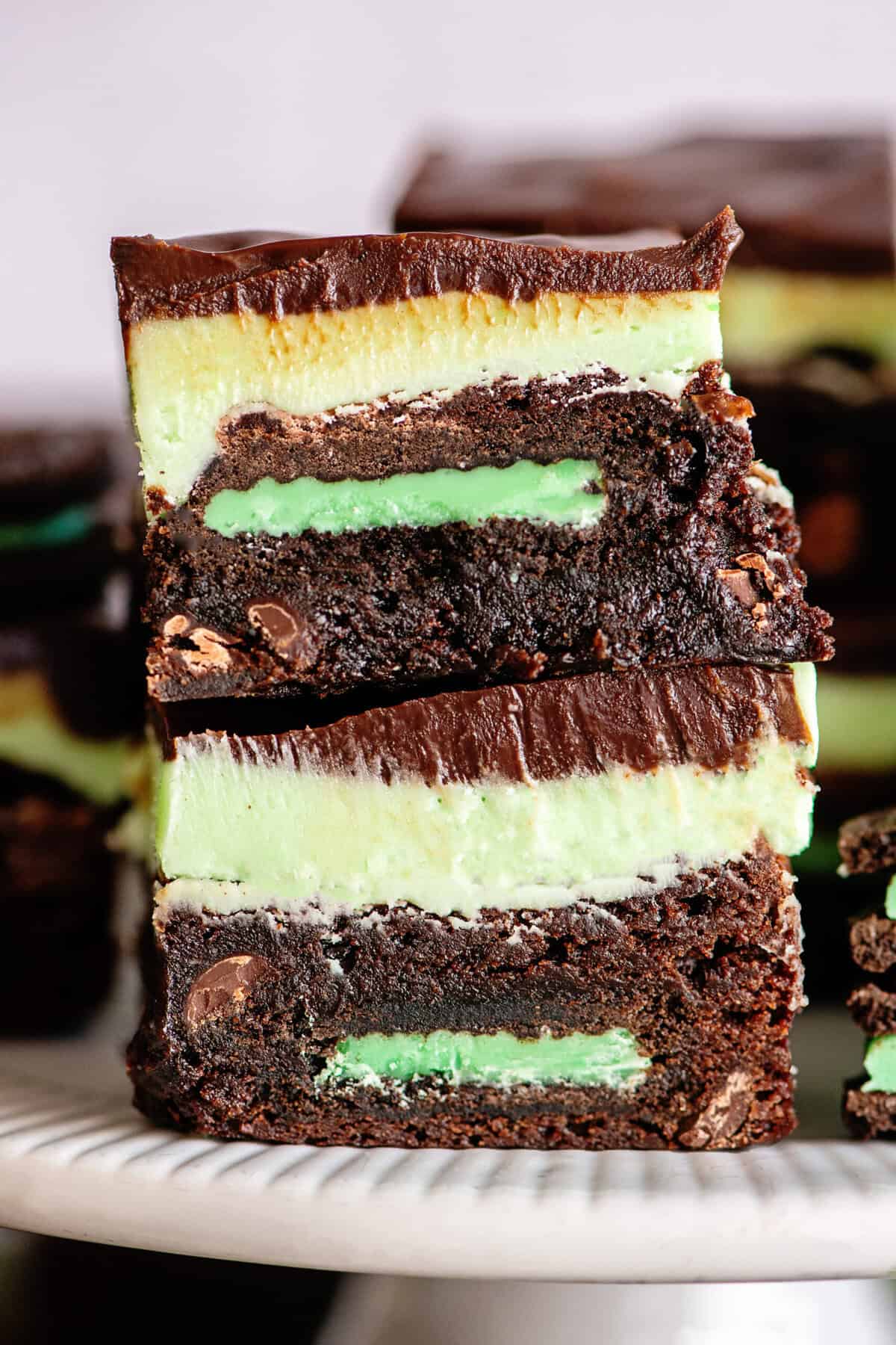 Close-up of grasshopper brownies stacked on each other.