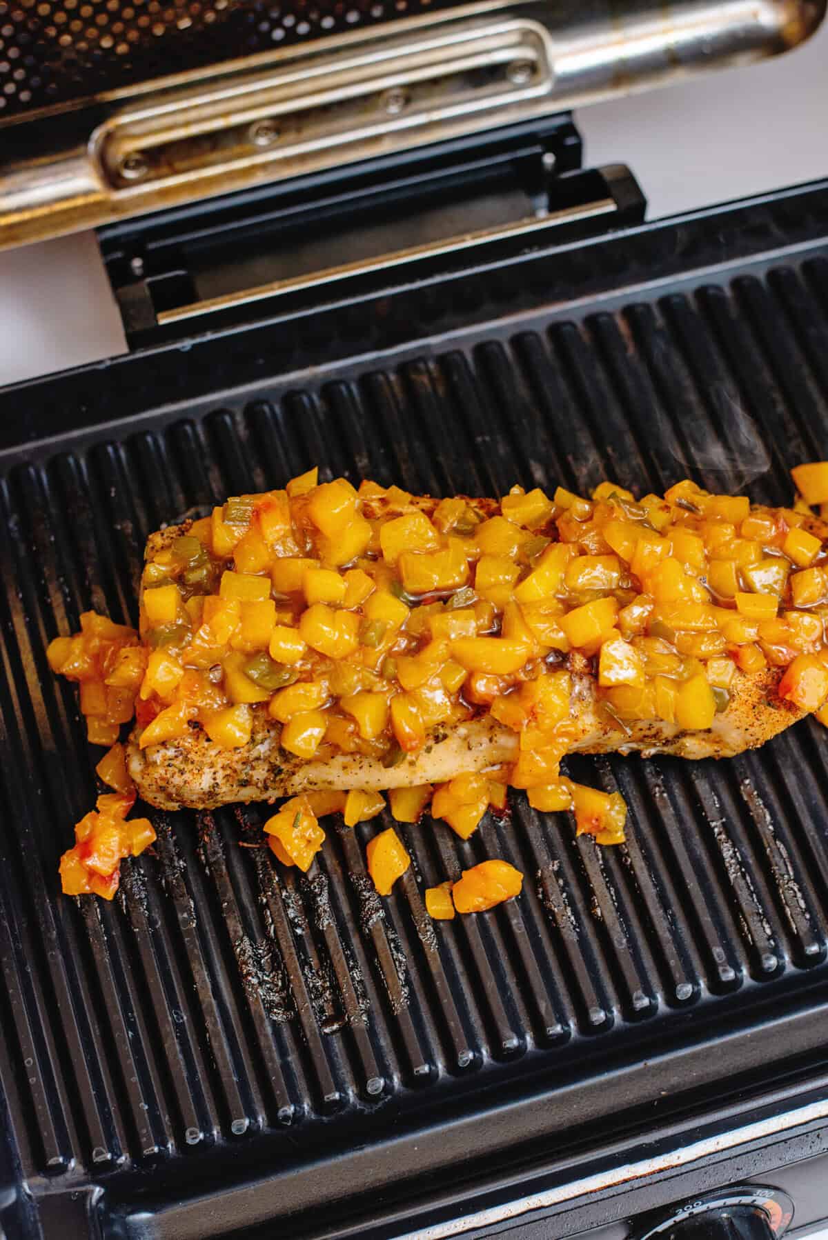 Peach jalapeno glazed pork tenderloin on the grill.