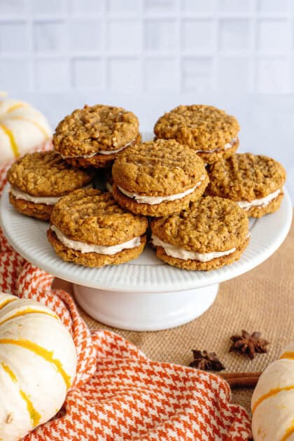 Pumpkin oatmeal cream pies on a cake stand.