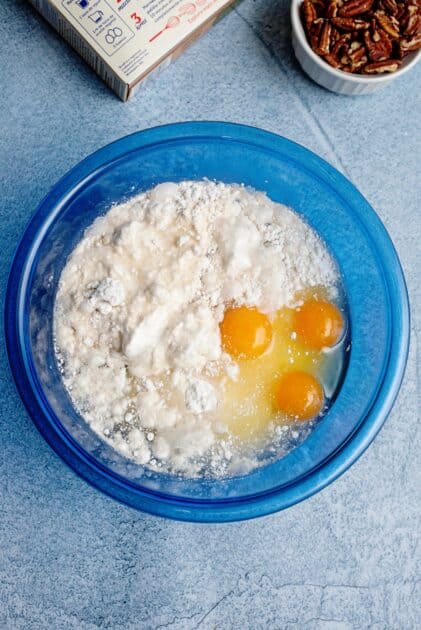 Cake mix, eggs, oil, and butterscotch schnapps in a mixing bowl