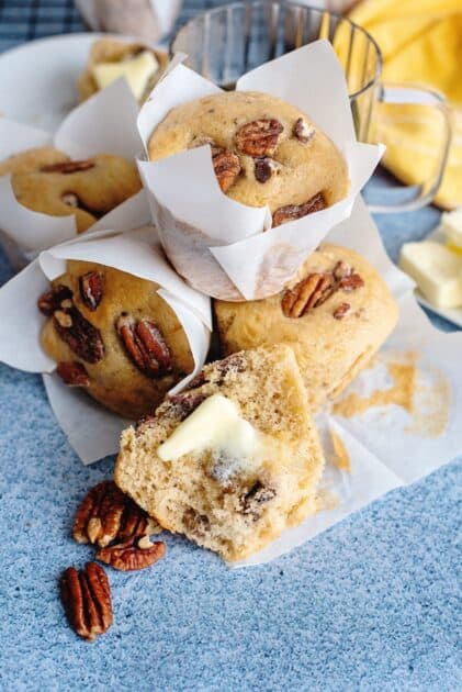 Stack of butter pecan muffins with pecans