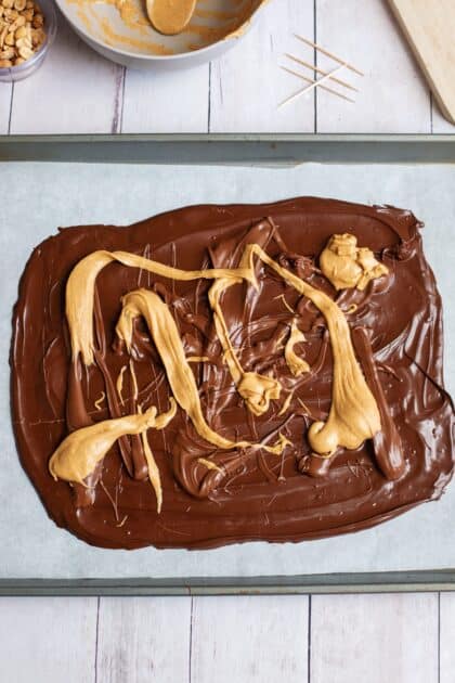 Melted peanut butter drizzled over the chocolate