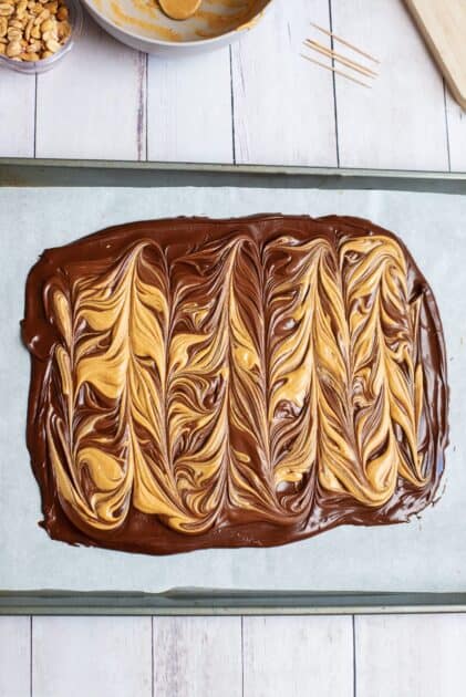 Peanut butter and chocolate swirled together on a baking sheet