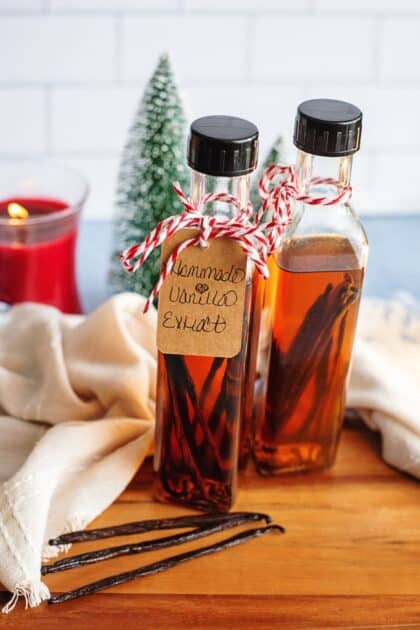 Homemade vanilla extract gift bottles with a handwritten tag
