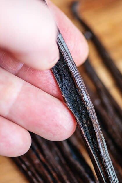 Split vanilla bean showing the tiny seeds inside